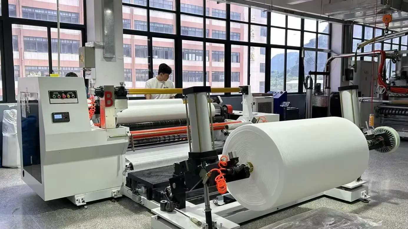 Factory converting equipment with jumbo white roll in production workshop