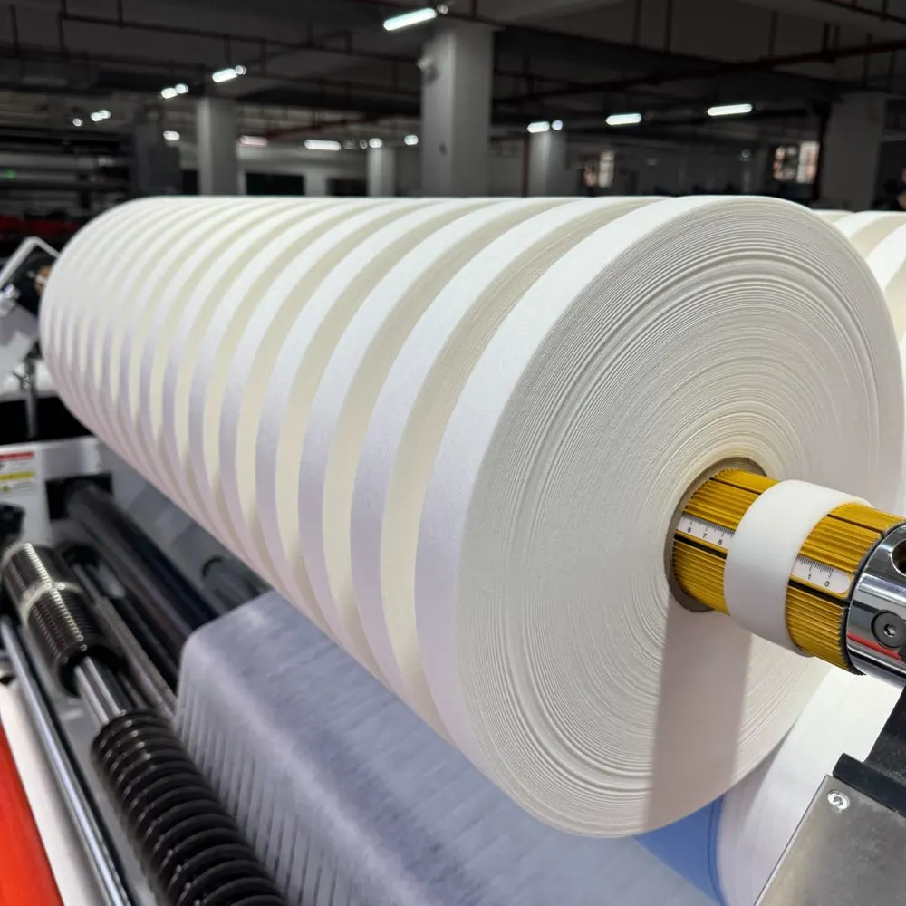 Factory slitting machine with large nonwoven roll